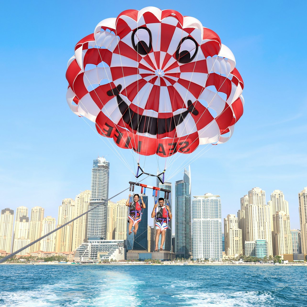 Soar high above Dubai's skyline enjoying panoramic views of the city and the Arabian Gulf. Experience the joy and serenity of parasailing in a remarkable seaside adventure.